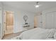 Serene bedroom features a pristine white bed, glass accent table, and ensuite bathroom for added convenience at 2648 Varner Ne Dr, Atlanta, GA 30345