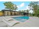 Stunning backyard with a sparkling pool, stylish lounge chairs, and lush greenery, creating an outdoor oasis at 2648 Varner Ne Dr, Atlanta, GA 30345