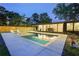 Gorgeous pool and patio with white lounge chairs, with a covered outdoor dining area at 2648 Varner Ne Dr, Atlanta, GA 30345