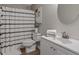 Cozy bathroom with shower and tub, white cabinets, updated vanity, and decor at 306 Birch St, Canton, GA 30114