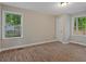 Bedroom features two windows and updated vinyl plank flooring at 306 Birch St, Canton, GA 30114