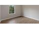 Bedroom with neutral colors, wood-look vinyl plank flooring and view from the window at 306 Birch St, Canton, GA 30114