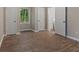 Spacious bedroom with neutral paint, vinyl floors, and a full bathroom entrance at 306 Birch St, Canton, GA 30114