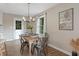 Dining area featuring a stylish table setting, natural light, and a tranquil view at 306 Birch St, Canton, GA 30114