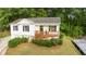 Charming home with a front porch and lush landscaping at 306 Birch St, Canton, GA 30114