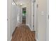 Hallway with neutral walls, white trim, and wood-look vinyl plank flooring at 306 Birch St, Canton, GA 30114