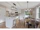 Well-appointed kitchen with white cabinetry, an island, and stainless steel appliances at 306 Birch St, Canton, GA 30114