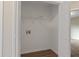 Neat, functional laundry area featuring a convenient shelf and wood-look flooring at 306 Birch St, Canton, GA 30114