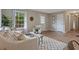 Cozy living room featuring a plush sofa, modern decor, and ample natural light at 306 Birch St, Canton, GA 30114