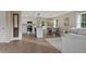 Bright, open floor plan integrating the living room, dining area, and a modern kitchen at 306 Birch St, Canton, GA 30114