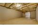 Unfinished basement with exposed ceiling insulation ready for customization at 3071 Springfair Trott, Lithonia, GA 30038