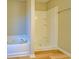 Bathroom with a white tiled shower and a soaking tub, offering a spa-like experience at 3071 Springfair Trott, Lithonia, GA 30038