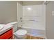 This updated bathroom features a tub and shower combination with built-in shelves at 3071 Springfair Trott, Lithonia, GA 30038