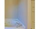 Close up view of a soaking tub with jets and tiled shower in a modern bathroom at 3071 Springfair Trott, Lithonia, GA 30038