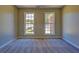 Bedroom with carpeted floors and two large windows bringing in natural light at 3071 Springfair Trott, Lithonia, GA 30038