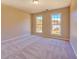 Spacious bedroom features neutral carpet, two windows, and natural light at 3071 Springfair Trott, Lithonia, GA 30038