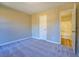Cozy bedroom featuring plush carpet, neutral walls, and a connected bathroom at 3071 Springfair Trott, Lithonia, GA 30038