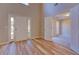 Open foyer with wood floors, a double-door entry, and a view into the adjacent room at 3071 Springfair Trott, Lithonia, GA 30038