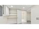 Utility area with open storage shelves, tile floors and access to another room at 3918 Oberlin Ct, Tucker, GA 30084