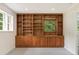 Bedroom featuring built-in shelving and storage with a soft carpet at 3918 Oberlin Ct, Tucker, GA 30084