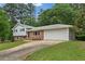 Charming two-story home with a two-car garage and well-manicured lawn at 3918 Oberlin Ct, Tucker, GA 30084