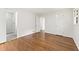 Spacious main bedroom with wood floors, multiple doors, and an attached bathroom at 3918 Oberlin Ct, Tucker, GA 30084