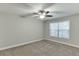 Carpeted bedroom with a ceiling fan and natural light at 4106 Santa Fe Pkwy, Atlanta, GA 30350