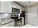 Updated kitchen with granite counters, stainless appliances, and ample cabinet space at 4106 Santa Fe Pkwy, Atlanta, GA 30350