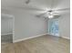Spacious living room with durable flooring, ceiling fan, and sliding glass doors to balcony at 4106 Santa Fe Pkwy, Atlanta, GA 30350