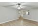 Spacious living room shows open floor plan to kitchen featuring granite countertops and stainless appliances at 4106 Santa Fe Pkwy, Atlanta, GA 30350