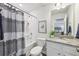 Charming bathroom features a shower-tub combo, toilet, and a granite countertop vanity at 1451 Stephens View Dr, Loganville, GA 30052