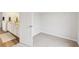 View of bathroom vanities through open door from adjacent walk-in closet at 1451 Stephens View Dr, Loganville, GA 30052