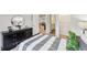 Neutrally decorated bedroom featuring a window, a bed, and dinosaur-themed decor at 1451 Stephens View Dr, Loganville, GA 30052