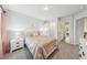 Bright bedroom features neutral walls, carpet, and a white dresser with two drawers at 1451 Stephens View Dr, Loganville, GA 30052