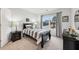 Neutrally decorated bedroom featuring a window, a bed, and dinosaur-themed decor at 1451 Stephens View Dr, Loganville, GA 30052