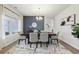 Sophisticated dining room features a dark wood table, stylish rug, and elegant decor at 1451 Stephens View Dr, Loganville, GA 30052