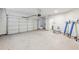 Spacious two car garage with new epoxy flooring and bright lighting at 1451 Stephens View Dr, Loganville, GA 30052