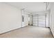 Clean garage interior with garage door partially open and access door at 1451 Stephens View Dr, Loganville, GA 30052