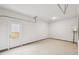Clean two-car garage with bright lighting and access door to the backyard at 1451 Stephens View Dr, Loganville, GA 30052