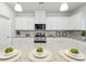 Well-appointed kitchen featuring granite countertops, stainless steel appliances, and ample storage space at 1451 Stephens View Dr, Loganville, GA 30052