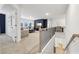 Open-concept living room featuring neutral decor, a media center, and staircase to the lower level at 1451 Stephens View Dr, Loganville, GA 30052
