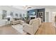 Bright and airy living room featuring a fireplace, comfortable seating, and abundant natural light at 1451 Stephens View Dr, Loganville, GA 30052