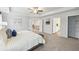 Spacious main bedroom features a tray ceiling and multiple entryways to the bathroom and closets at 1451 Stephens View Dr, Loganville, GA 30052