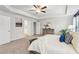 Large main bedroom with carpet flooring features a tray ceiling and walk-in closet at 1451 Stephens View Dr, Loganville, GA 30052