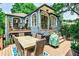 Multi-level backyard deck with dining area, grill, and stairs leading to the upper balcony at 2639 Acorn Ne Ave, Atlanta, GA 30305