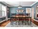 Formal dining room showcasing dark trim, hardwood floors, and modern chandelier lighting at 2639 Acorn Ne Ave, Atlanta, GA 30305
