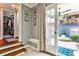 Inviting entryway featuring a walk-in closet, built-in bench, and access to the patio at 2639 Acorn Ne Ave, Atlanta, GA 30305
