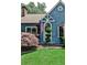 Close-up of a home's exterior showcasing a manicured lawn, flowering shrubs, and architectural details at 2639 Acorn Ne Ave, Atlanta, GA 30305