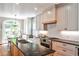Beautiful eat-in kitchen with granite countertops, stainless steel appliances, and stylish cabinets at 2639 Acorn Ne Ave, Atlanta, GA 30305