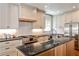 Well-equipped kitchen featuring granite countertops, stainless steel appliances, and a cozy breakfast nook at 2639 Acorn Ne Ave, Atlanta, GA 30305